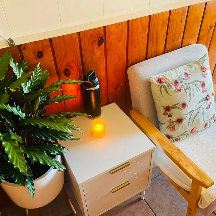 Waiting area with plant and candle